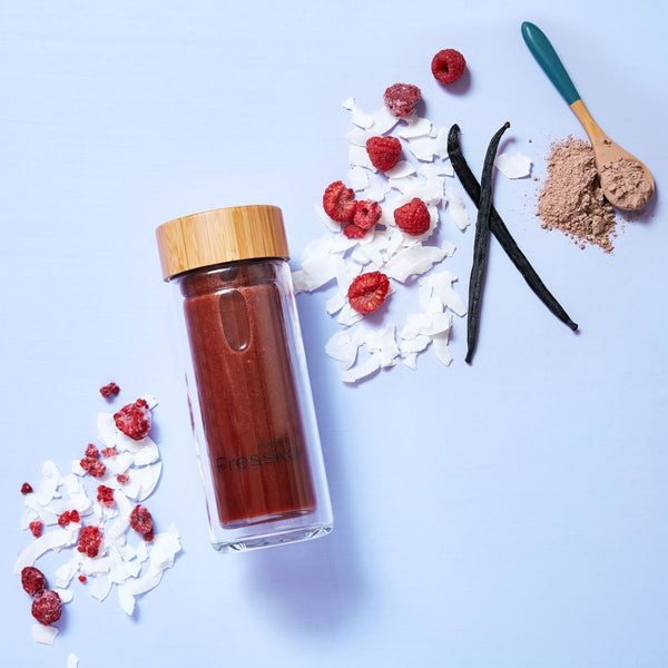 glass fressko flask with chocolate lamington smoothie with vanilla bean and coconut flakes